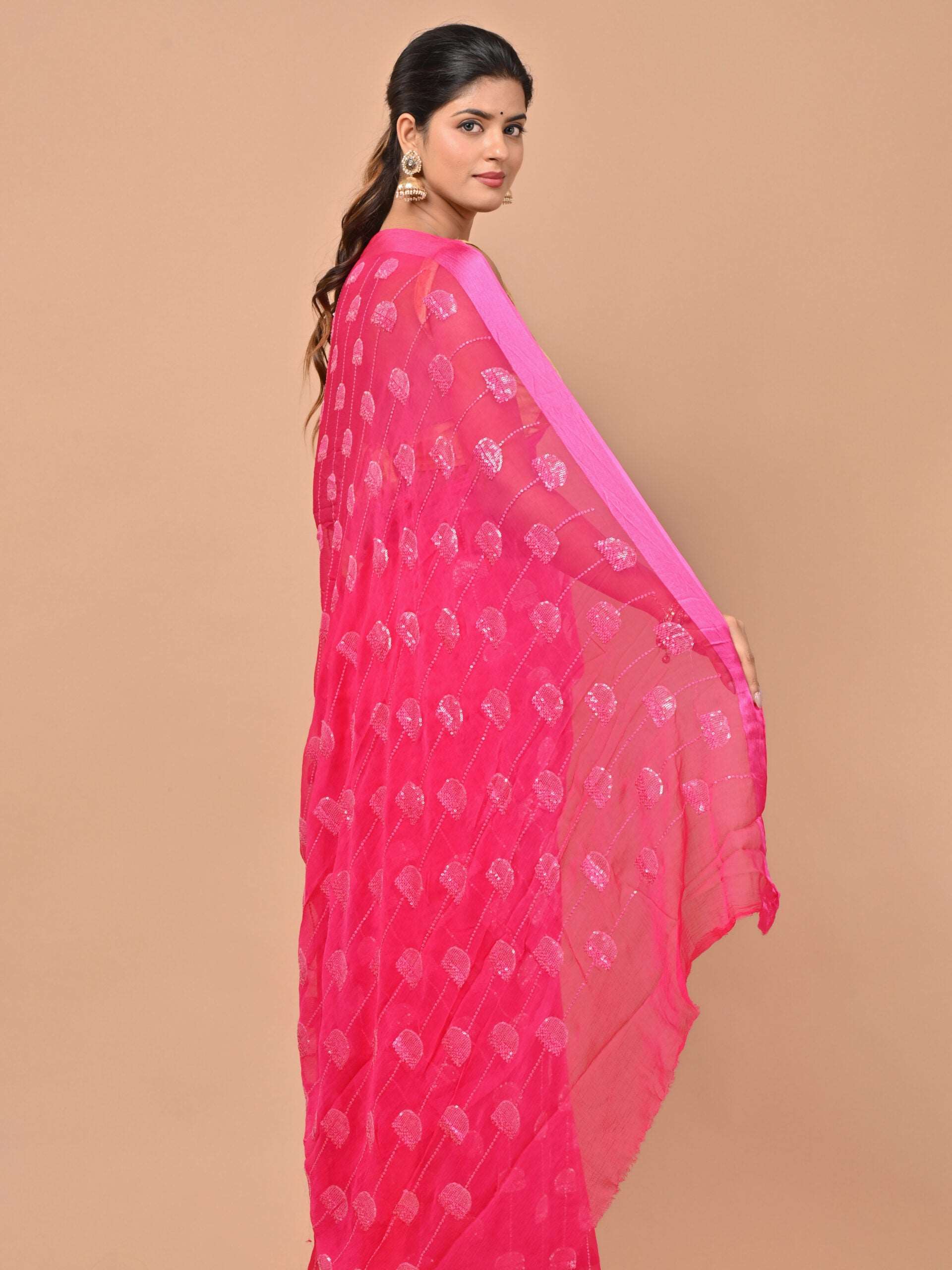 Pure chiffon Rani pink color saree embellished with thread and sequins